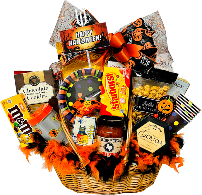 A Halloween-themed gift basket filled with assorted treats, including cookies, chips, chocolate candies, and popcorn. Decorated with orange and black ribbons, feathers, and spooky motifs. A "Happy Halloween" sign is prominently displayed.