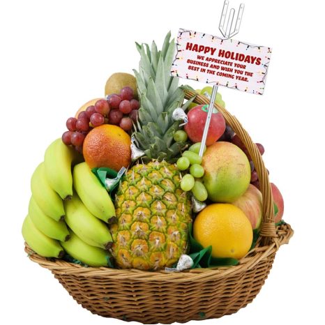 A wicker basket filled with a variety of fruits, including bananas, a pineapple, grapes, oranges, and apples. A holiday card is attached, reading "Happy Holidays. We appreciate your business and wish you the best in the coming year.